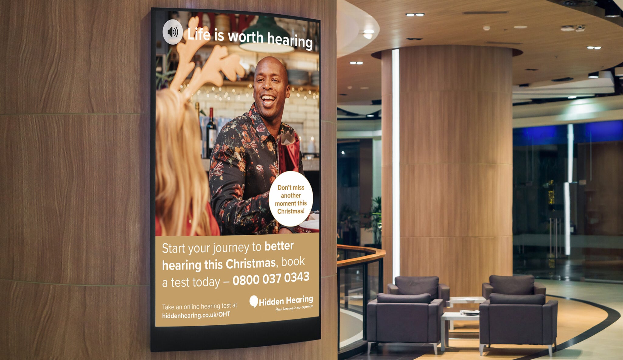 Hidden Hearing campaign photography — Life Is Worth Hearing displayed in a hotel