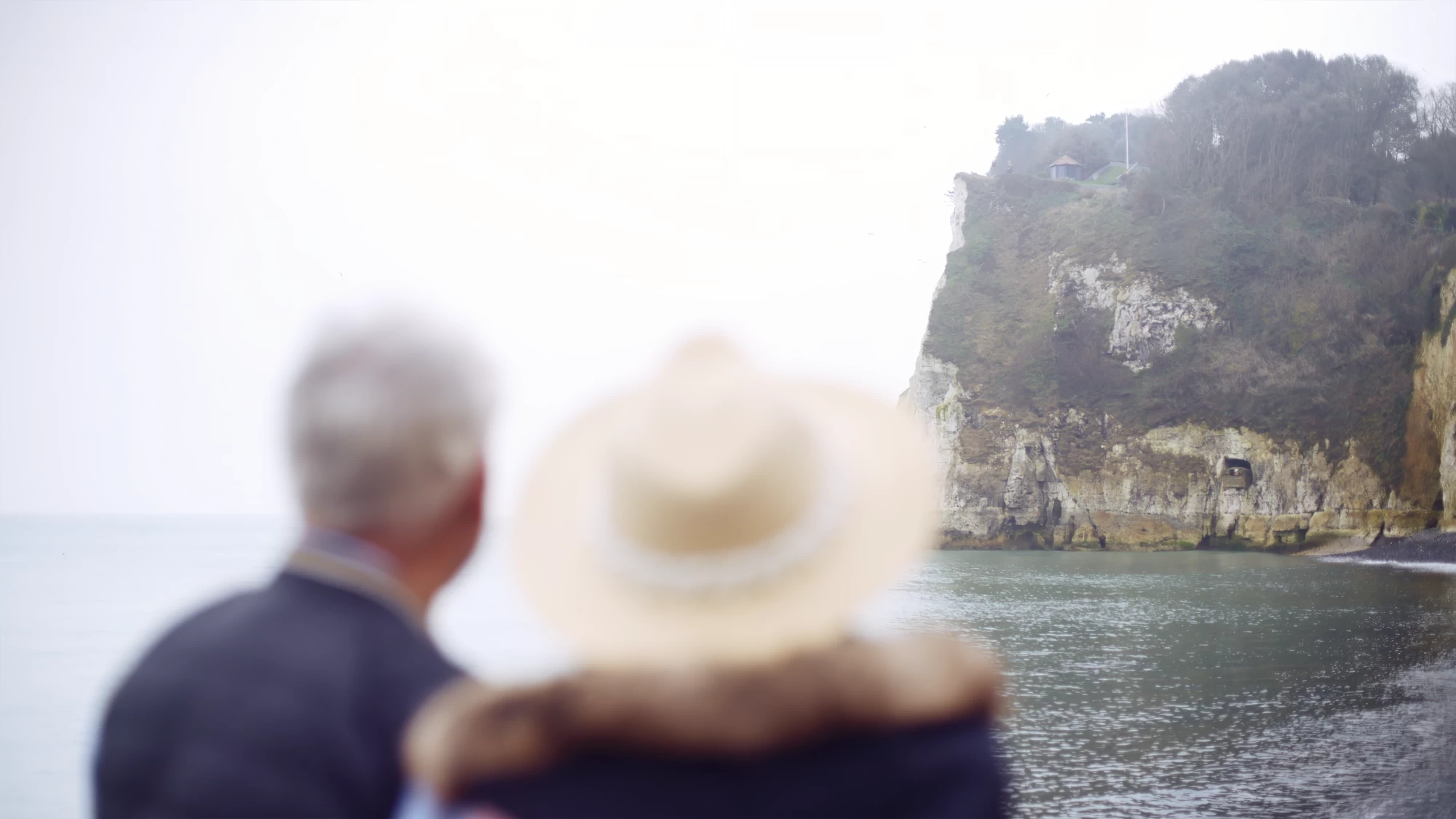 Visit Kent tourism photography — empty-nester couple looking out over the White Cliffs and coastline